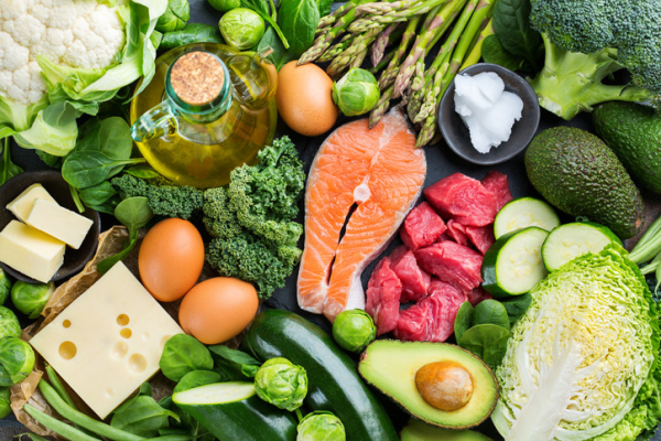 Healthy foods for low-carb diet include salmon, cauliflower, avocado, meat, plain yogurt, varied green vegetables